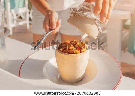 Testi kebab is an authentic Turkish delicious meat dish baked in a clay pot, served after breaking the jug. Royalty-Free Stock Photo #2090632885