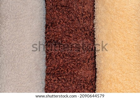 Terry towels of different colors. Folded towels