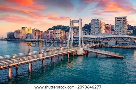 Wonderful sunrise in Durres port, city on Adriatic Sea in western Albania, Europe. Stunning Adriatic seascape. Incredible spring scene of Albania. Traveling concept background. Royalty-Free Stock Photo #2090646277