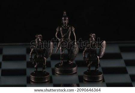 black chess pieces on a chessboard