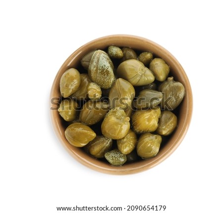 Capers in bowl isolated on white, top view Royalty-Free Stock Photo #2090654179