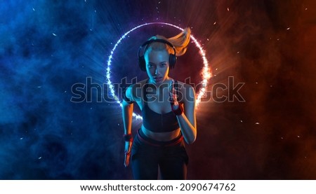 Sprinter run. Strong athletic woman running on black background with neon lights wearing in the sportswear. Fitness and sport motivation. Runner concept. Royalty-Free Stock Photo #2090674762