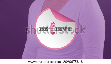 Composition of woman with breast cancer awareness ribbon and believe text against purple background. breast cancer awareness campaign and vector concept.