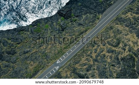 Road along the ocean. Aerial view from drone. Hawaii, USA - December 2021. High quality photo