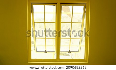yellow windows with yellow walls.