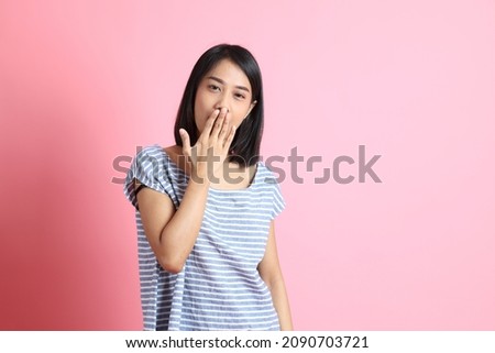 The Asian woman on the pink background.
