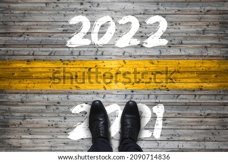 Welcome 2022 - Goodbye 2021 - New Year Start Concept Royalty-Free Stock Photo #2090714836
