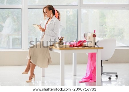 Female fashion designer working in studio