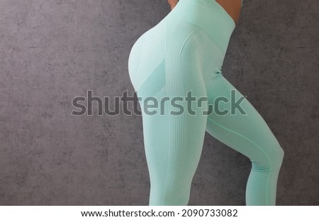 Close up of buttocks fitness woman in sportswear. Home fitness workout. Female athletic glutes and legs close up. Royalty-Free Stock Photo #2090733082