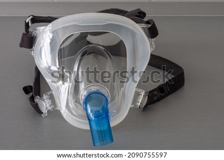 Non-invasive ventilation face mask, close up view, in ICU in hospital. Royalty-Free Stock Photo #2090755597