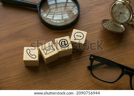 Variety of contact approach. Icon of phone, email, post and chat on a wooden cube.