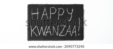Happy Kwanzaa concept. African-American holiday. Congratulatory lettering on a white background. Banner format