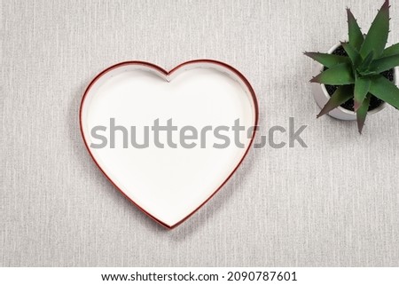 Heart model with empty space for logos, advertising inscription, photograph, on grey background