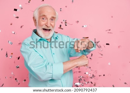 Photo of energetic middle aged man dance fall confetti enjoy discotheque isolated over pastel color background