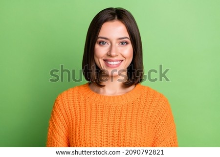 Portrait of attractive content cute cheerful girl wearing soft jumper isolated over bright green color background