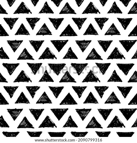 Seamless pattern with black triangular silhouettes. Abstract geometric hipster fashion design print. Handdrawn shapes of triangles with rough edges in grunge style. Vector black and white ornament.