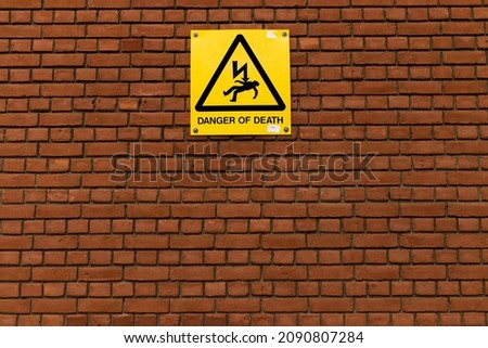 signs on red brick walls