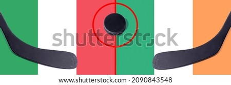 Top view hockey puck with Italy vs. Irish command with the sticks on the flag. Concept hockey competitions