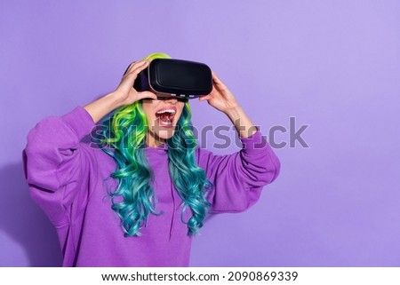 Photo of surprised youth lady with vivid haircut look 3d tech goggles illusion wear jumper isolated over violet color background