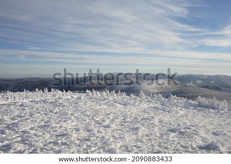 Jeseniky mountains, Czech Republic, Czechia. View from Keprnik hill. Wavy landscape, horizon and nature  is covered by white snow in the winter season and wintertime. Royalty-Free Stock Photo #2090883433