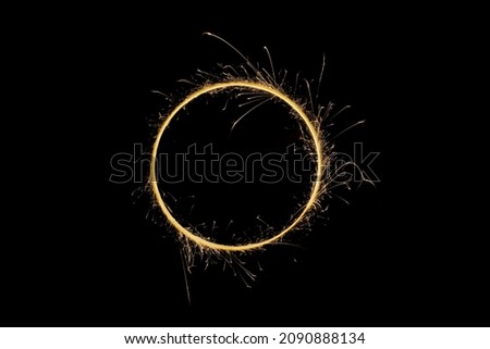 Circle with sparks on a black background Royalty-Free Stock Photo #2090888134