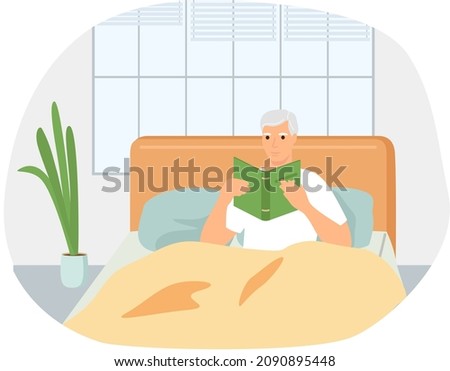 Cute man in pajamas reading literature on his bed comfortably. Book lover concept with young man lying relax on sofa and reading book. Concept of homeward and comfort. Person relaxes after work Royalty-Free Stock Photo #2090895448