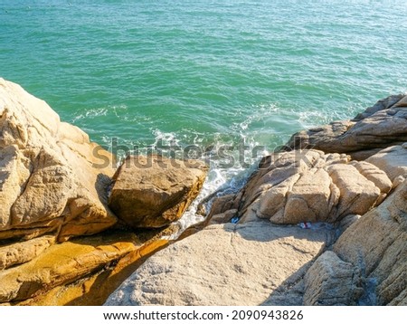 Seaside rock island reef waves