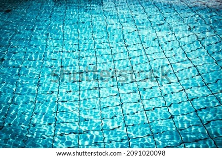 Blue water background. Abstract summer sea pattern. Pool water surface or wave texture