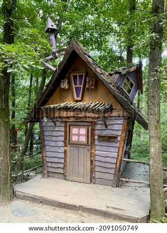 Tiny wooden forest house; vertical photo; hobbit house concept at Ormanya Park Turkey, selective focus