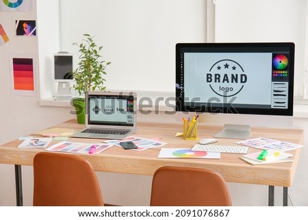 Comfortable workplace of graphic designer in office Royalty-Free Stock Photo #2091076867