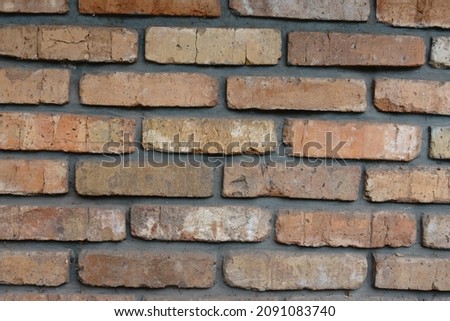 Surface of simple old rugged brick wall