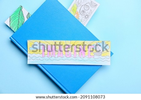 Cute bookmarks with book on color background