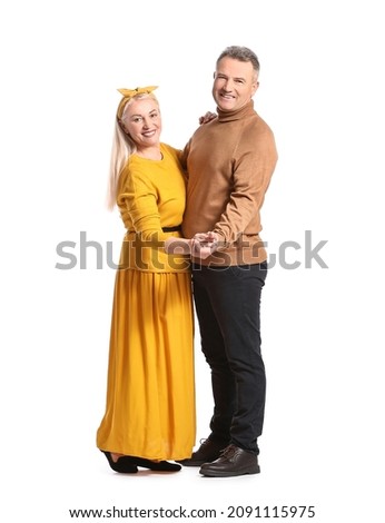 Dancing mature couple on white background
