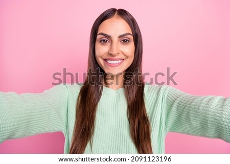 Photo of cool millennial brunette lady do selfie wear green pullover isolated on pink color background
