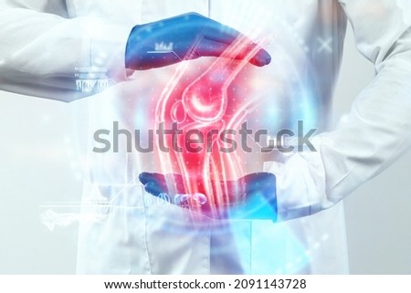 The doctor looks at a hologram of a sore knee, severe pain. X-ray image, trauma, rheumatologist consultation, skeletal image, medical concept, medical technologies of the future, pain when walking Royalty-Free Stock Photo #2091143728