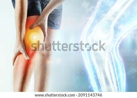 The doctor looks at a hologram of a sore knee, severe pain. X-ray image, trauma, rheumatologist consultation, skeletal image, medical concept, medical technologies of the future, pain when walking Royalty-Free Stock Photo #2091143746
