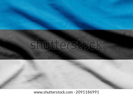 Estonian flag on wavy fabric.