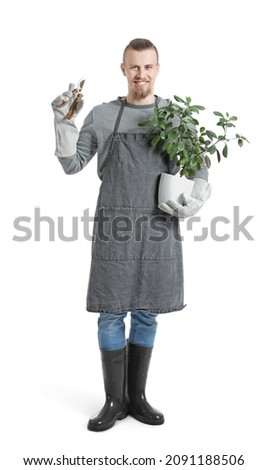 Young male gardener on white background