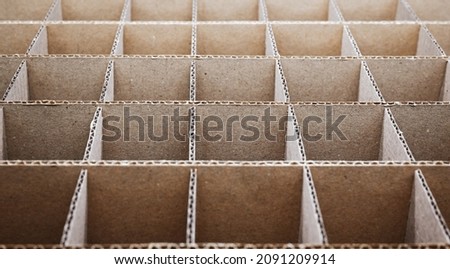 Abstract background. Square cardboard partitions close-up. Partitions for transporting fragile glass items.