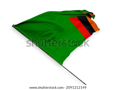 Zambia's flag is isolated on a white background. flag symbols of Zambia. close up of a Zambian flag waving in the wind.