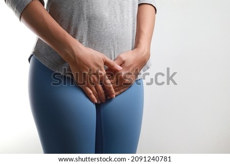 Midsection woman having painful stomachache with hands holding pressing her crotch lower abdomen Royalty-Free Stock Photo #2091240781