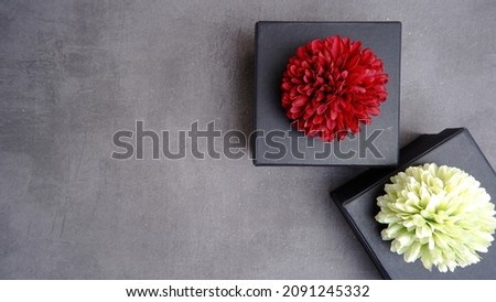 An elegant and neatly arranged gift box on a table on a gray background. new year and christmas concept. Valentine gift concept. Top View. High angle view.