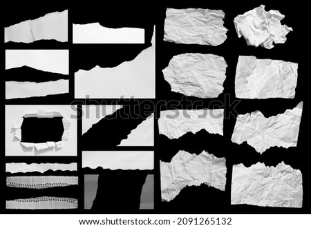 torn paper isolated on black background with copy space for text