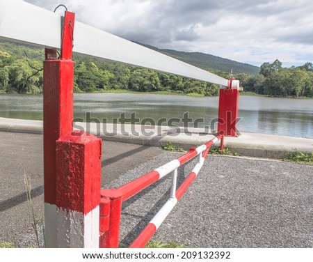 red Barrier Gate with mountain and lake  background