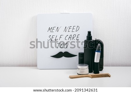Men self care kit with male beauty care products and devices and letter board with text Men need self care too. Man set with skin and hair care products for boyfriend, husband father brother Royalty-Free Stock Photo #2091342631