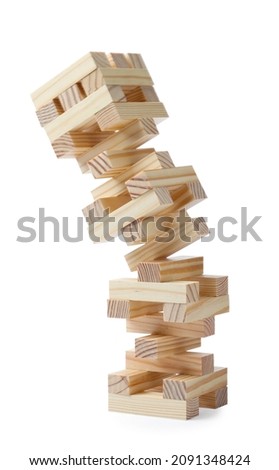 Jenga tower made of wooden blocks falling on white background Royalty-Free Stock Photo #2091348424
