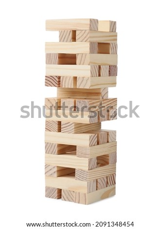 Jenga tower made of wooden blocks on white background Royalty-Free Stock Photo #2091348454