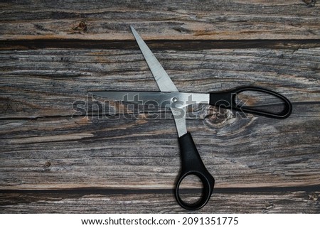 Stylish Professional Barber Scissors, Hair Cutting on wood background. Hairdresser salon concept, Hairdressing Set. Haircut accessories. Copy space image, flat lay Royalty-Free Stock Photo #2091351775