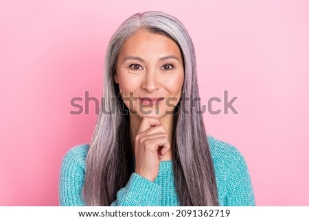 Portrait of cheerful thoughtful businesswoman mature woman wear blue pullover isolated on pink color background