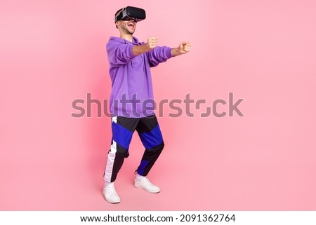 Full body photo of young guy vr glasses driver car auto game play isolated over pink color background